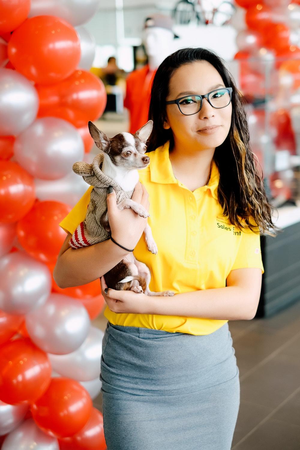 Employee posing with dog