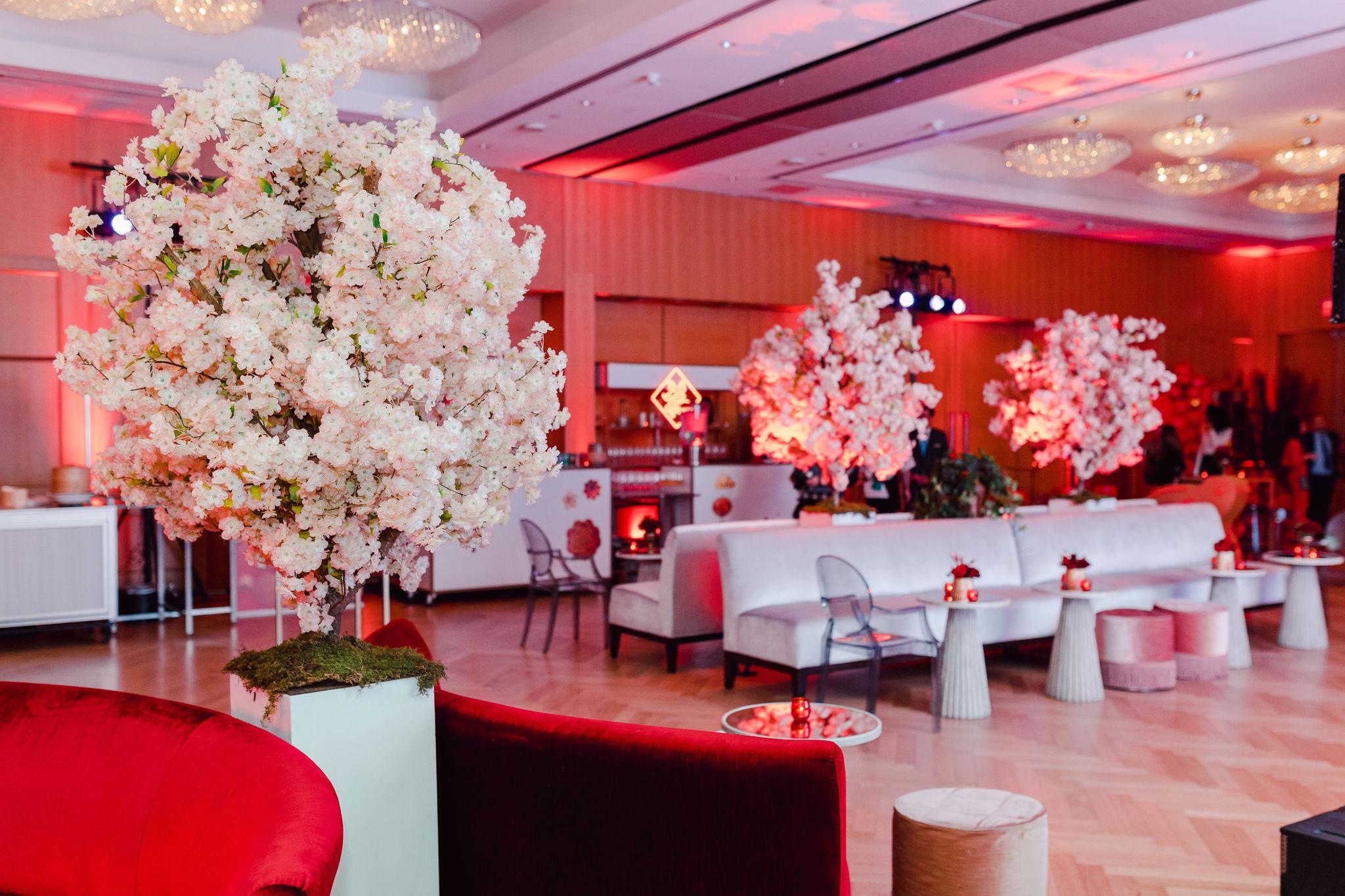 ballroom, decorated, flowers, red couches.