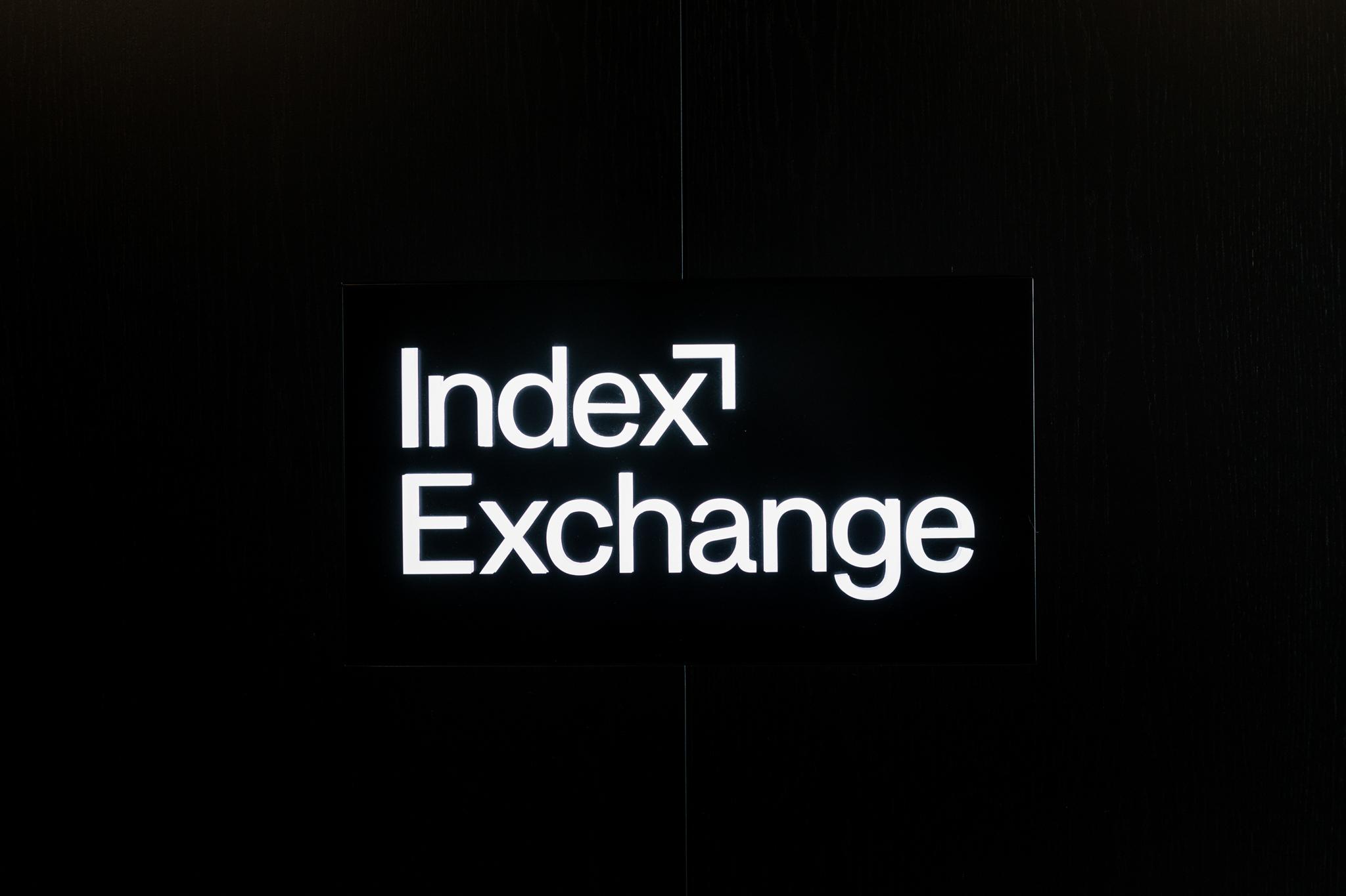 Black wall, sign, index exchange.