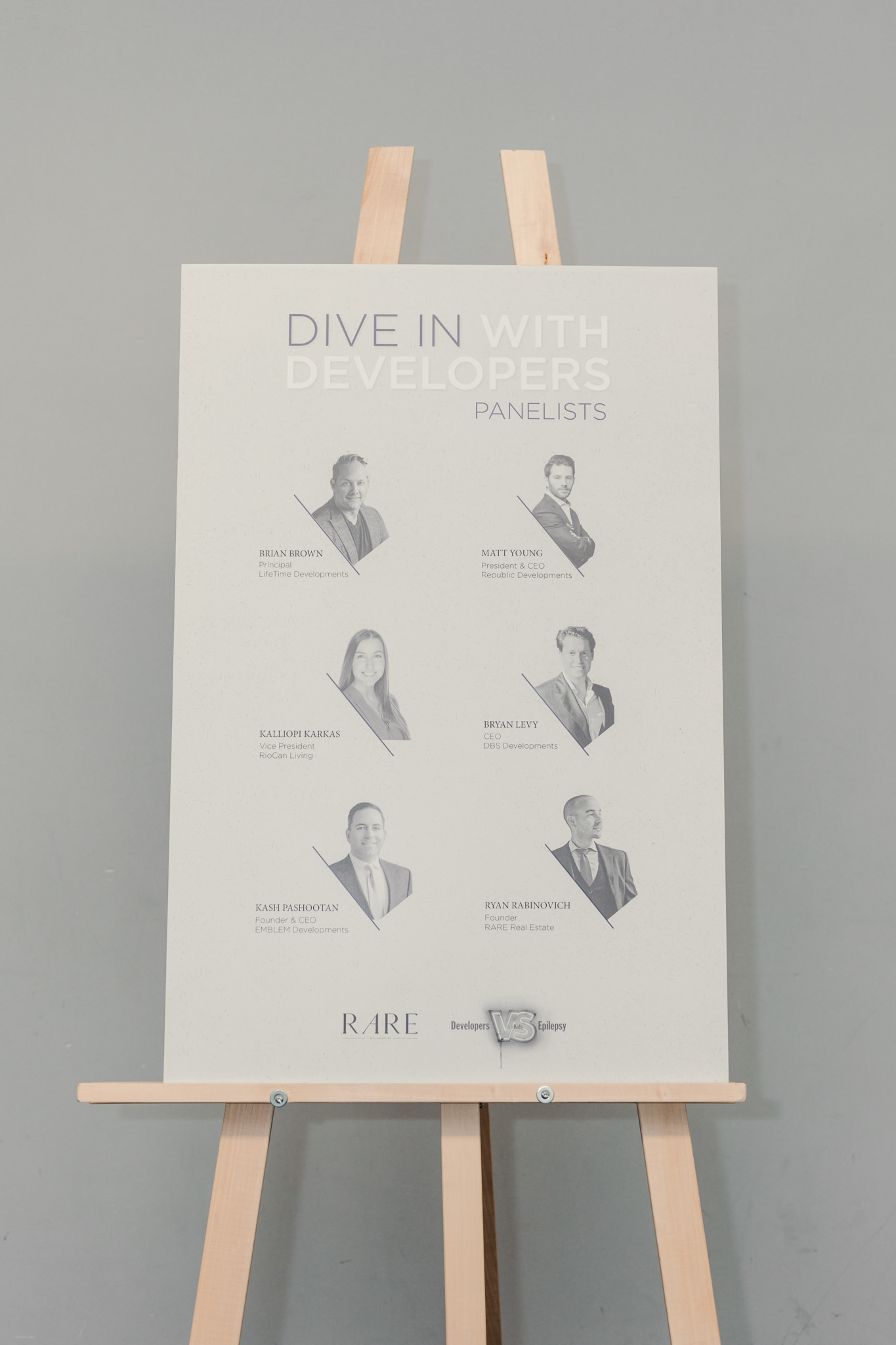 A poster with the words dive in with us on a easel.