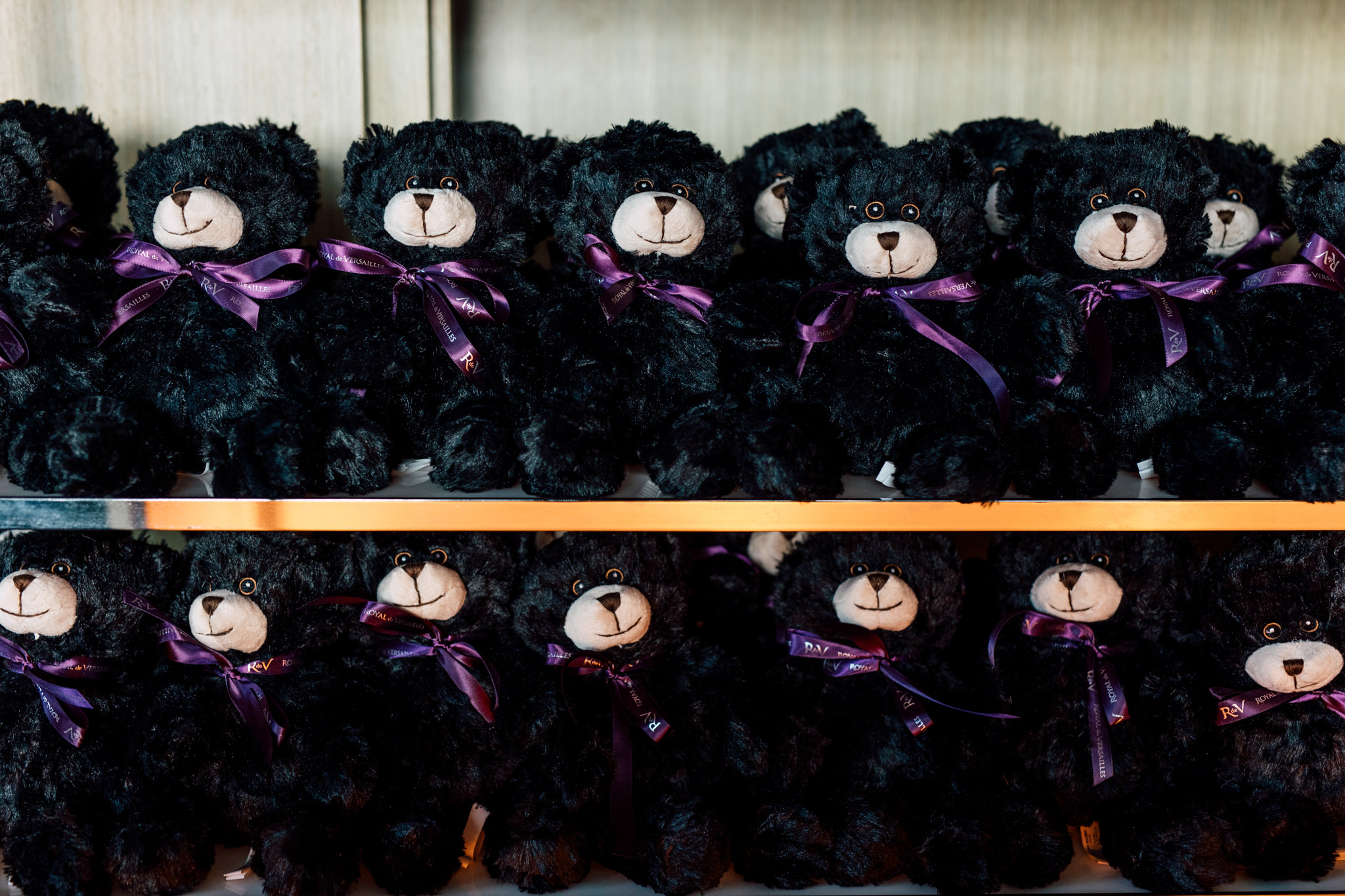 Row, black, teddy bears.
