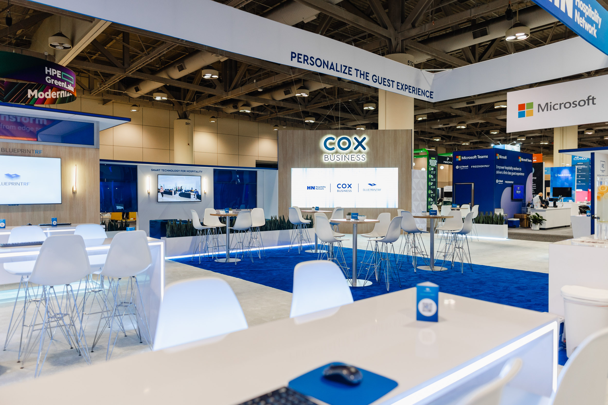 A Toronto trade show booth featuring blue and white design elements.