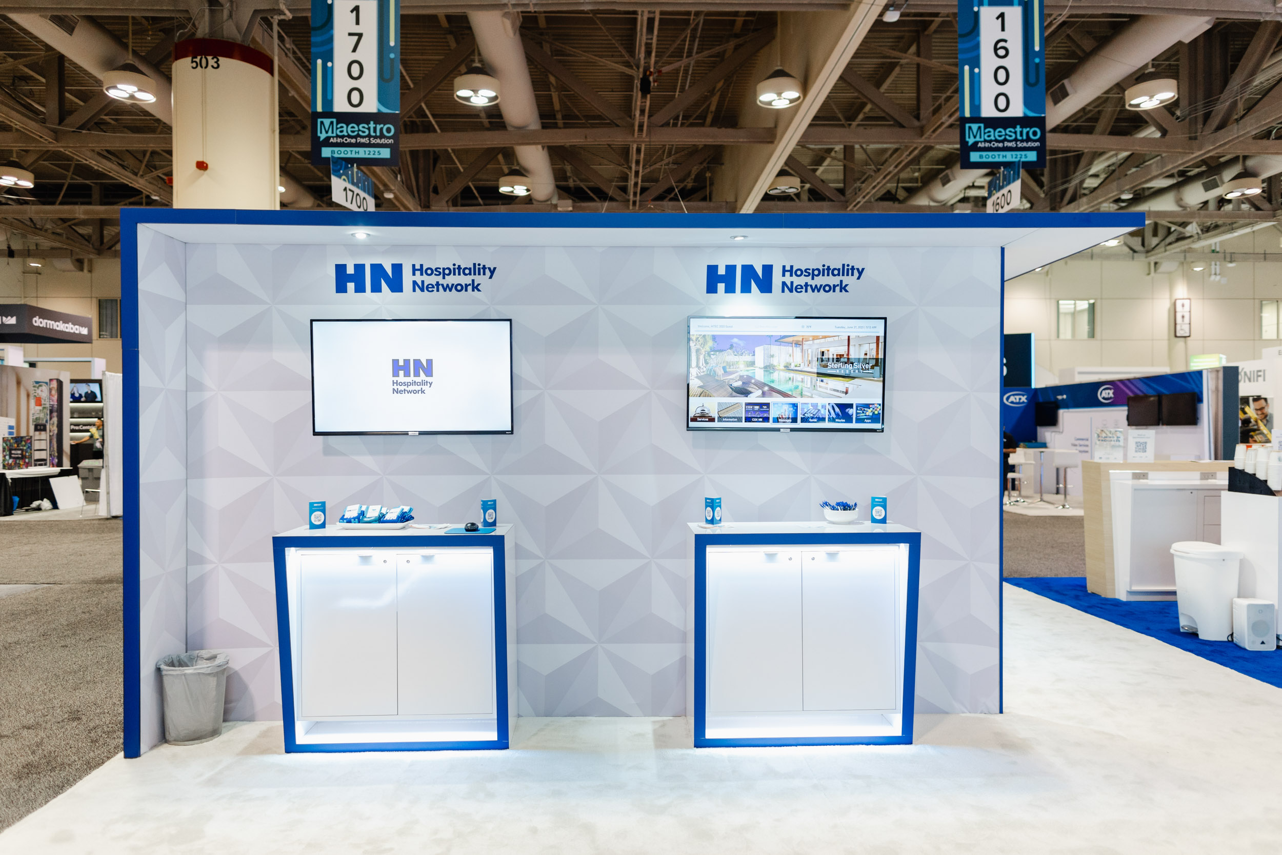 A Toronto trade show booth featuring a blue and white color scheme.
