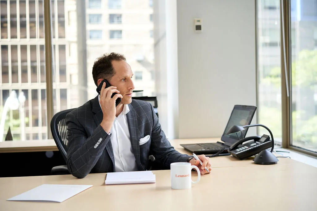 Man, suit, cell phone, office.
