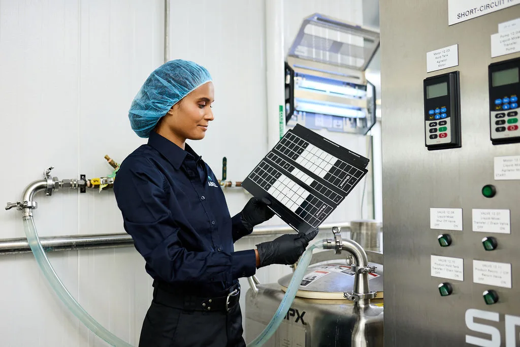 Woman, tablet computer, factory.
