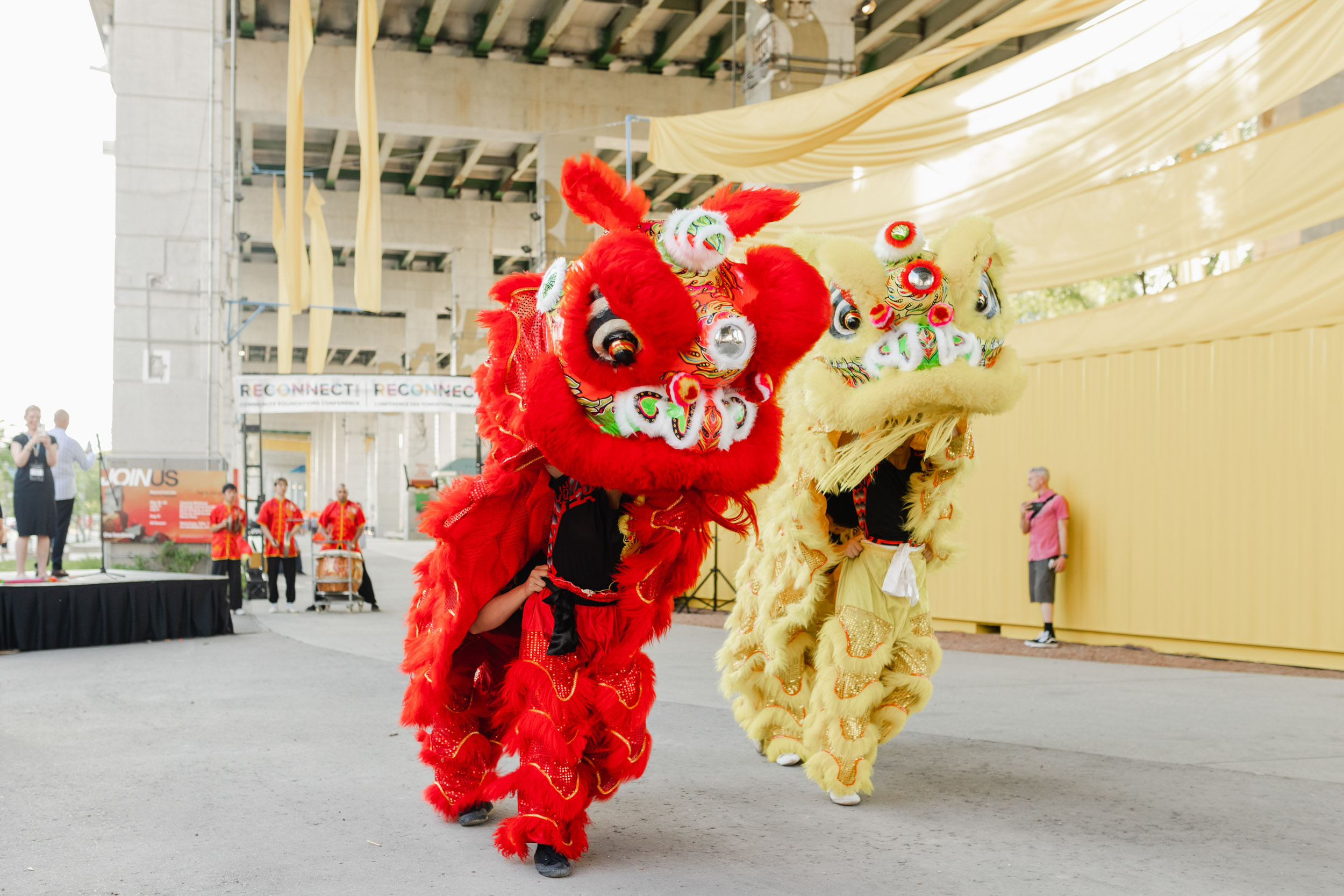 Conference photography featuring two Chinese lion dancers.