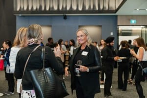 Women networking at a business event.