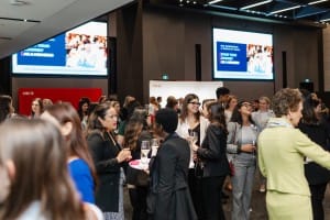 A group of people attending a grand opening event.