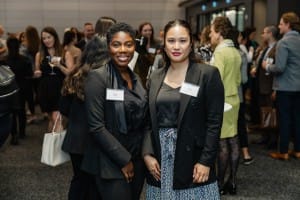 Two women at a grand opening event.