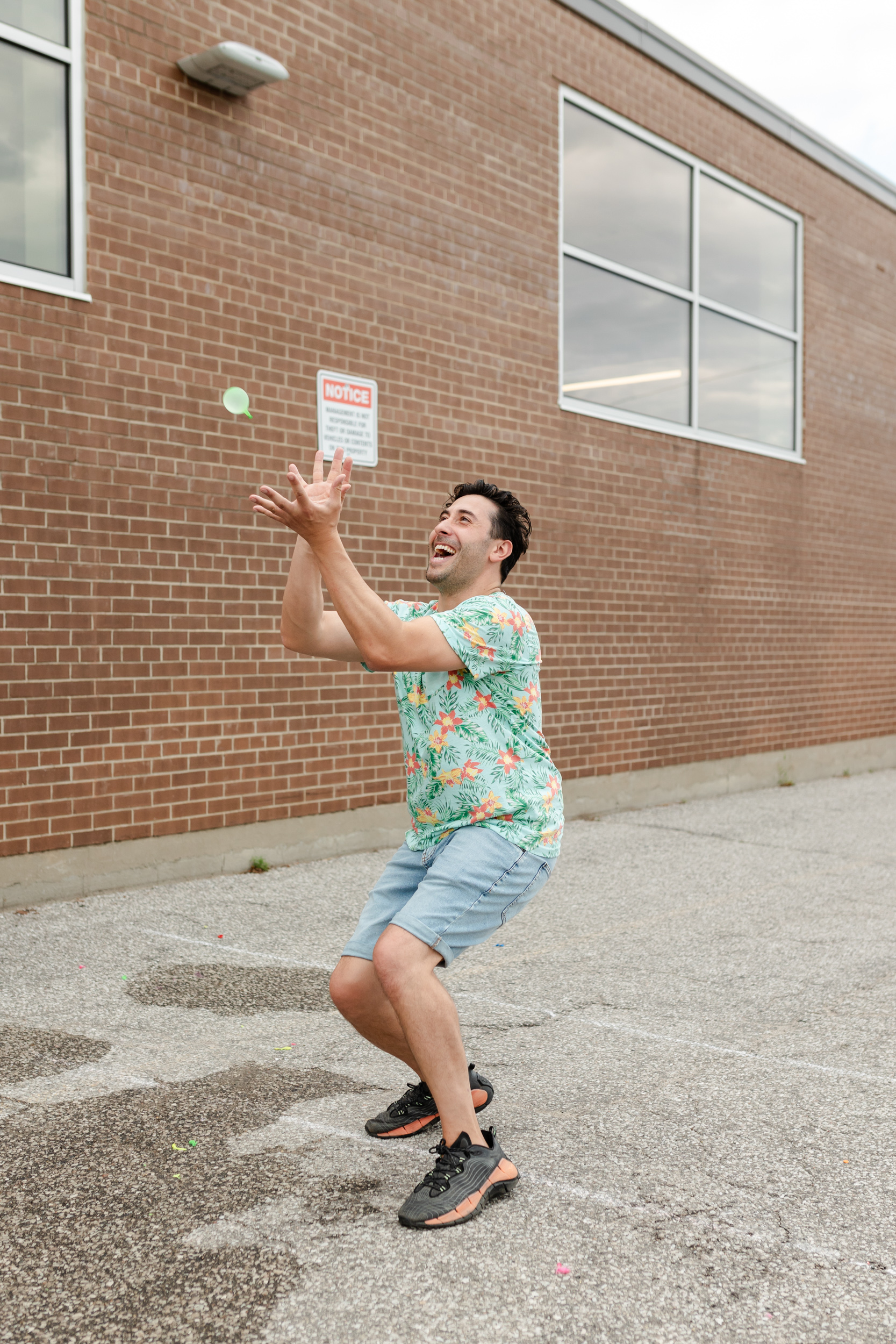 Social event: A man catching a frisbee during social gathering.