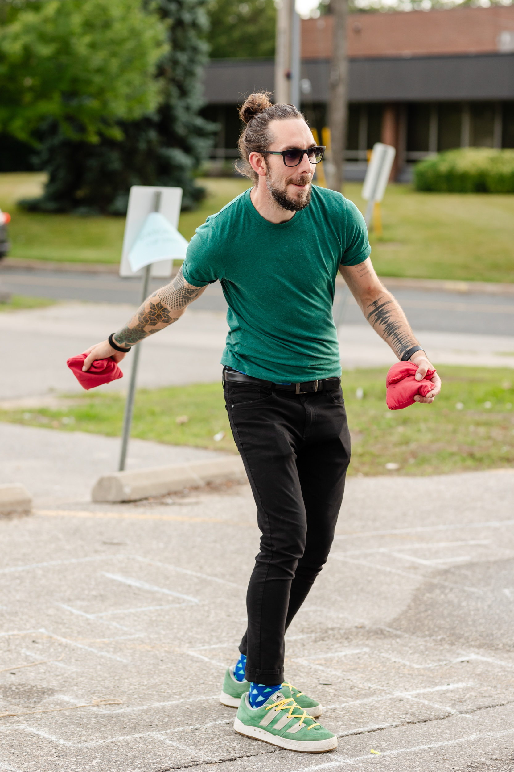 A man is engaging in a social frisbee game.
