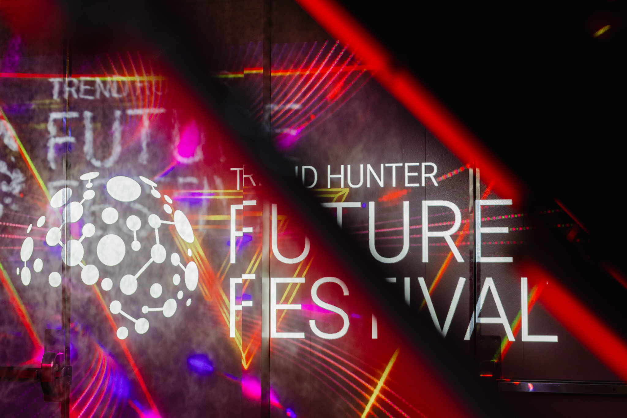 A neon sign advertising a future festival event.
