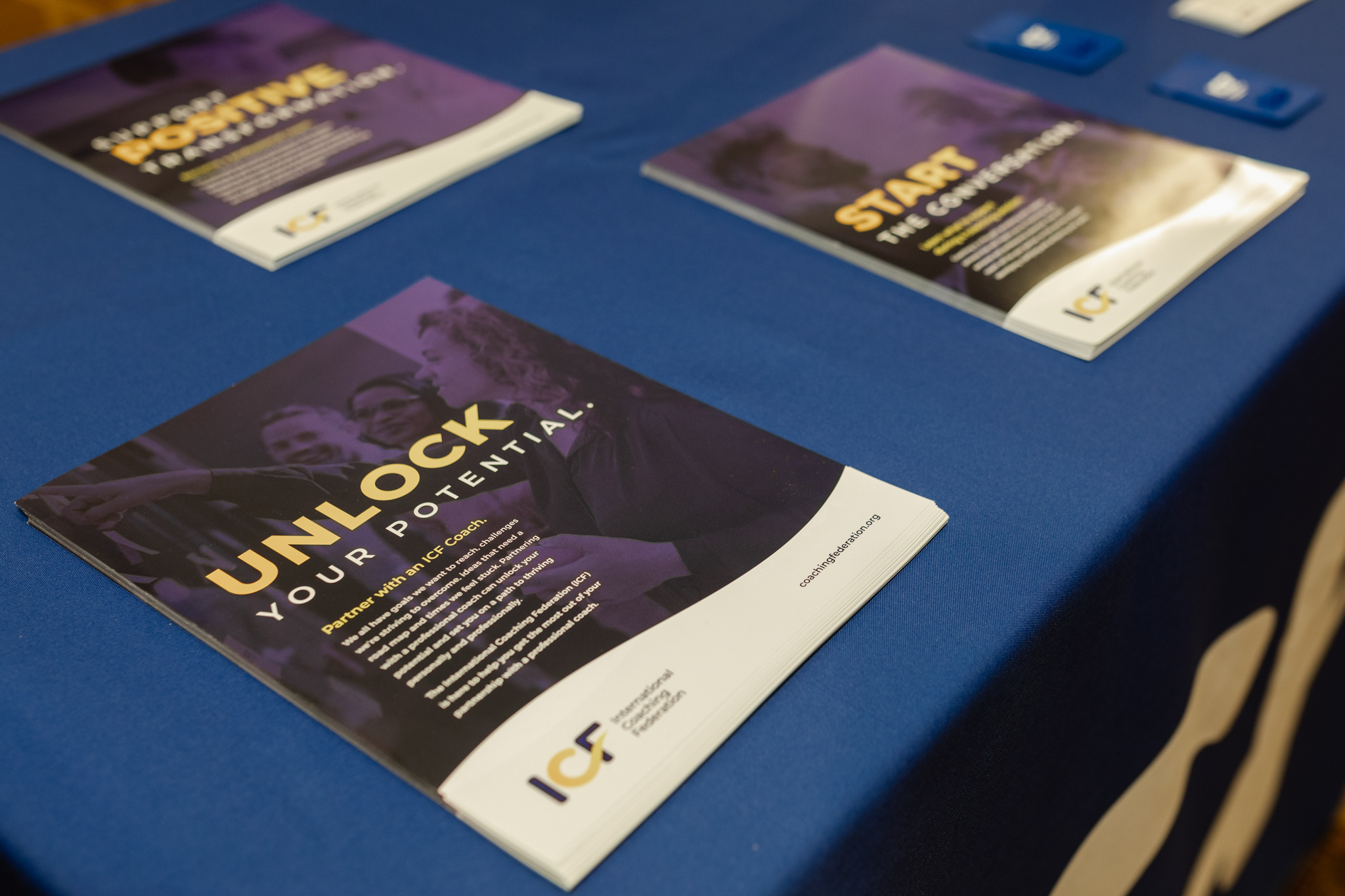 A blue table filled with various brochures about event photography.