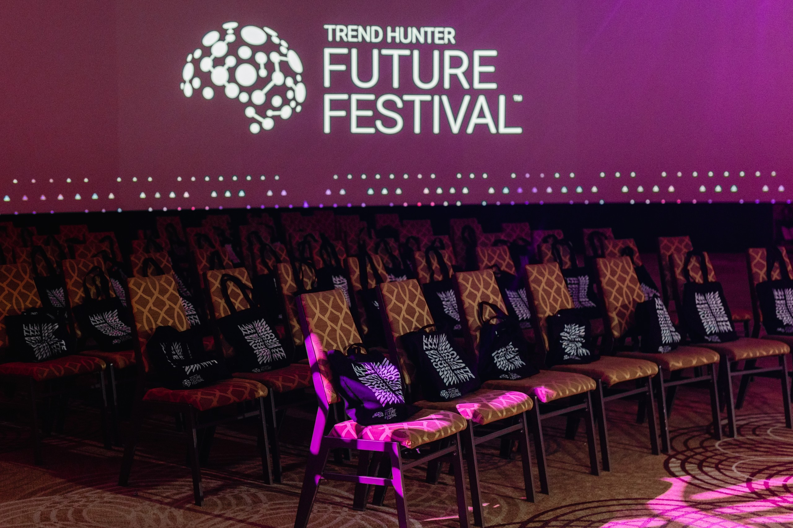 A room full of chairs with the words future festival on them, perfect for event photography.