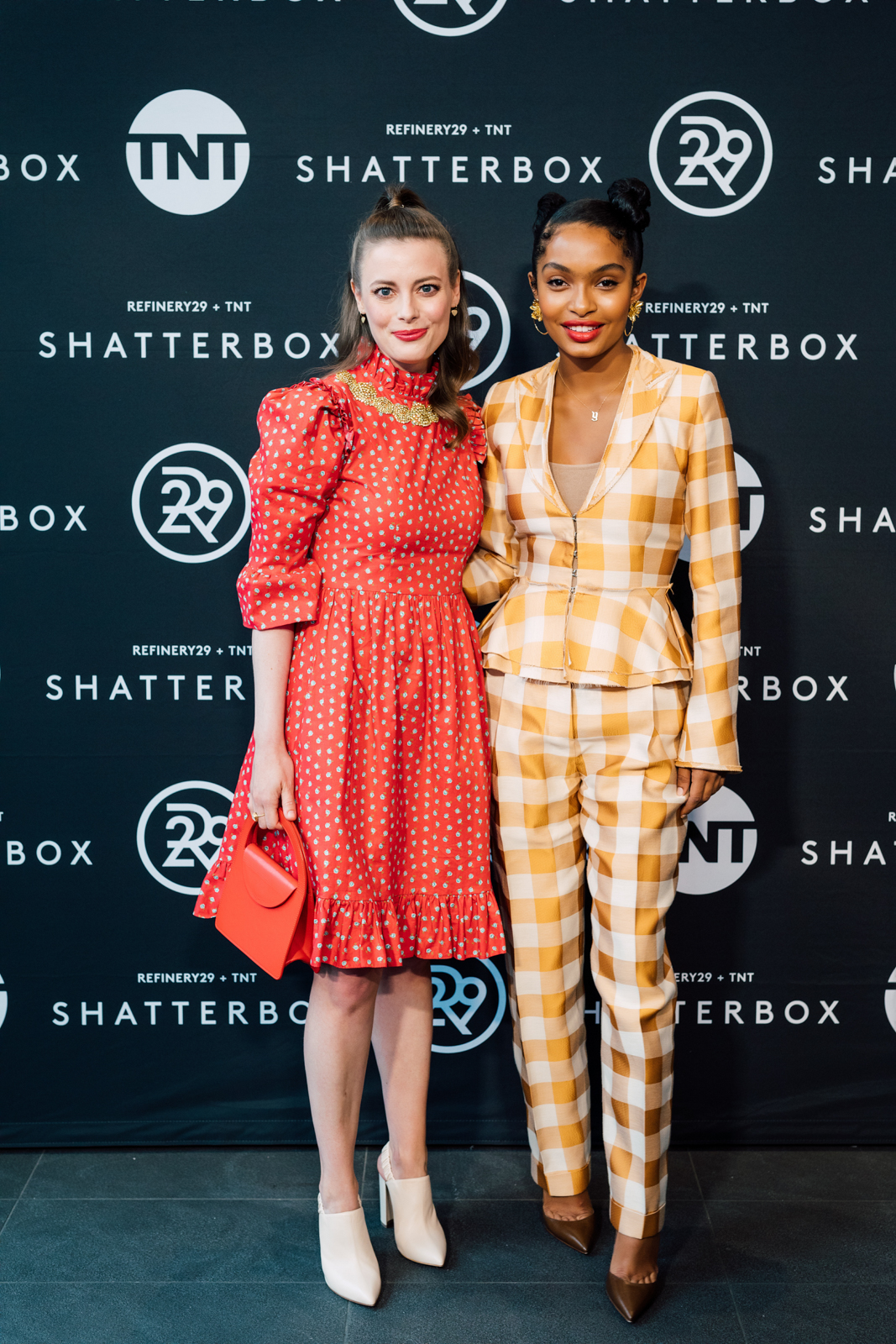 Two women posing at the shatterbox event for event photography.