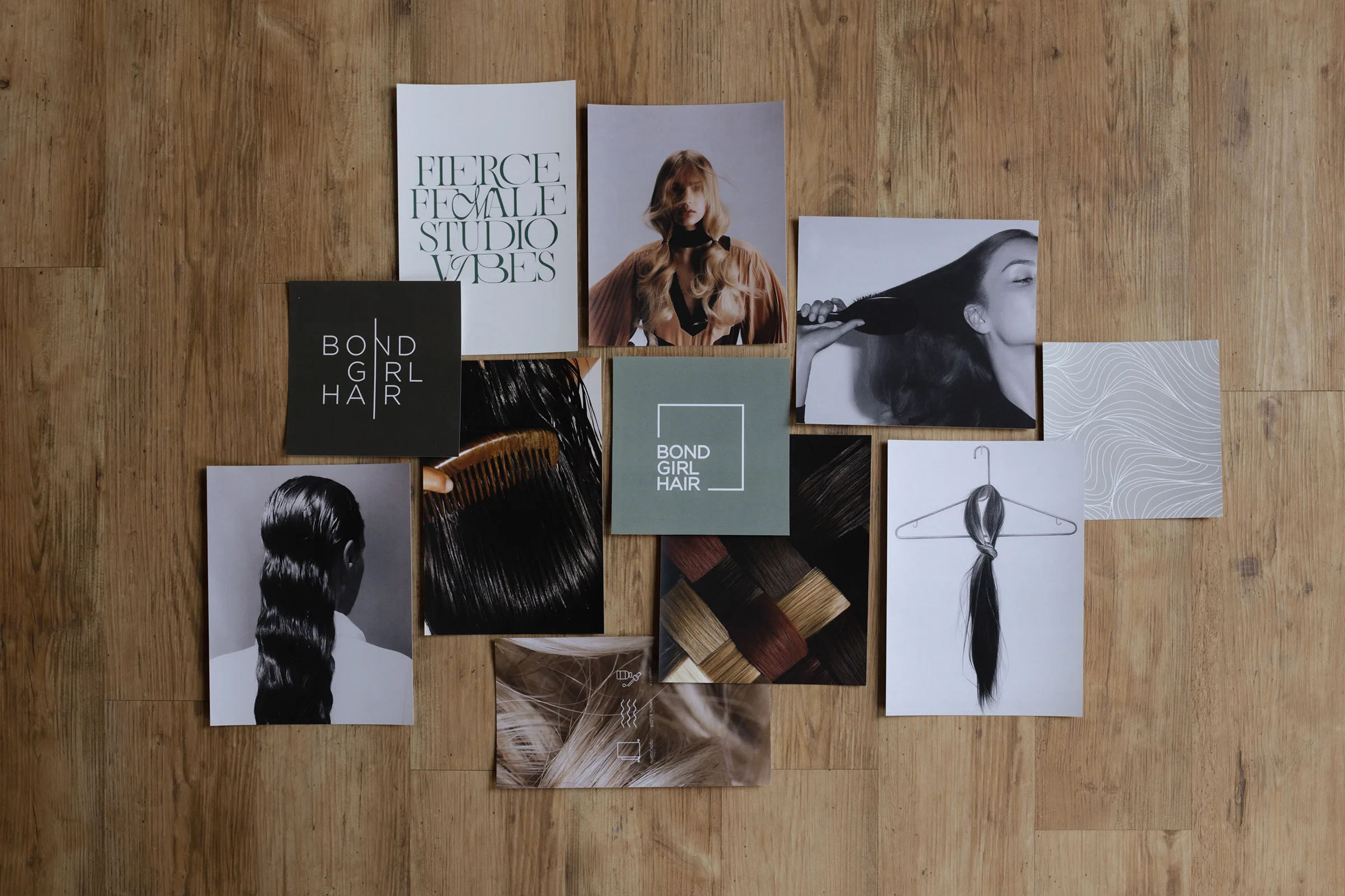 A collection of photos on a wooden floor.