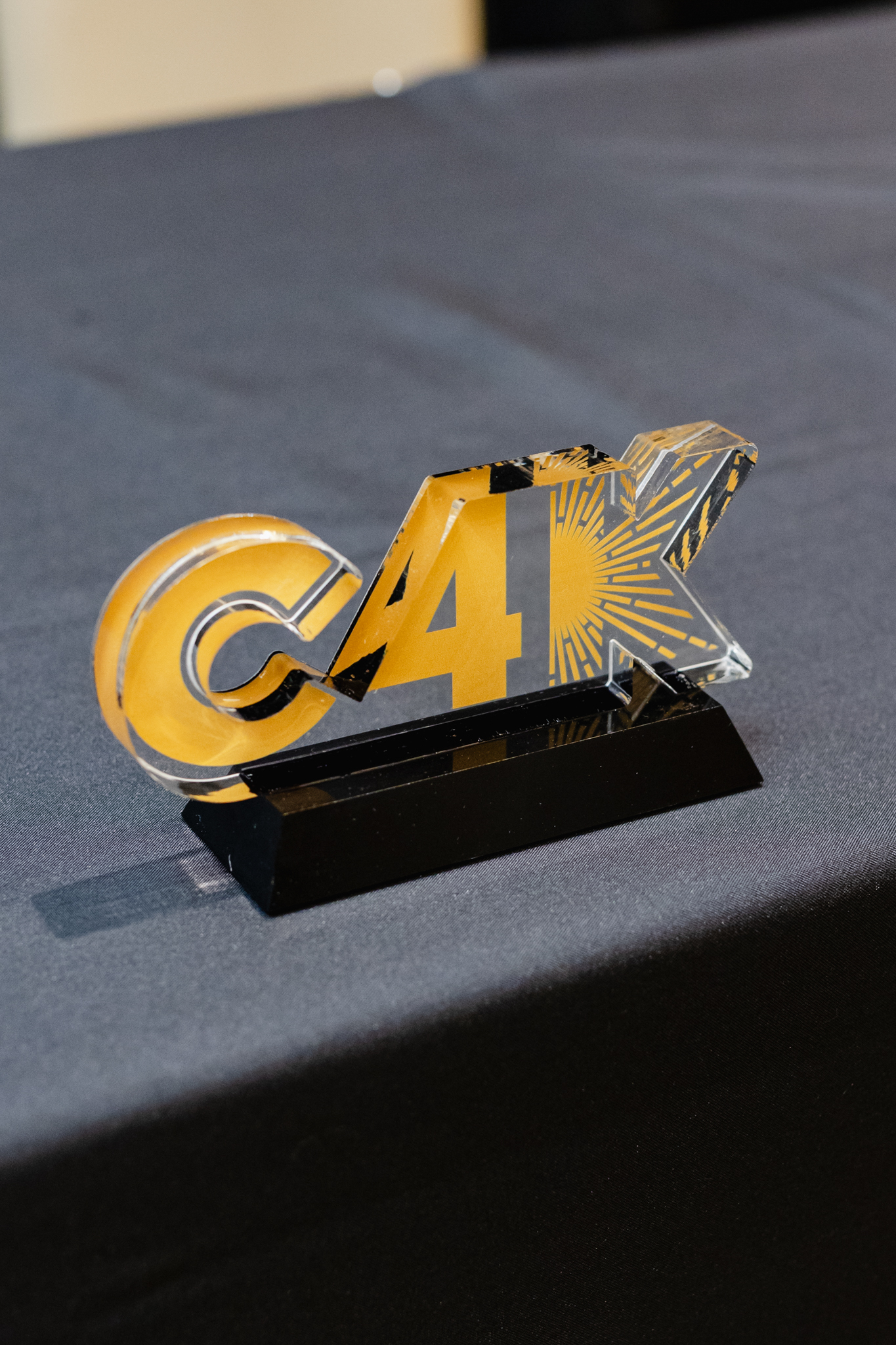 The c4k award is sitting on top of a conference table.