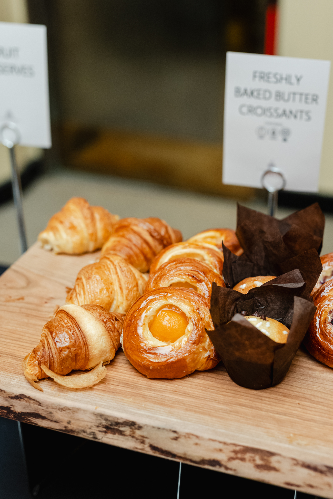 Conference attendees can indulge in a delicious assortment of pastries displayed elegantly on a table.