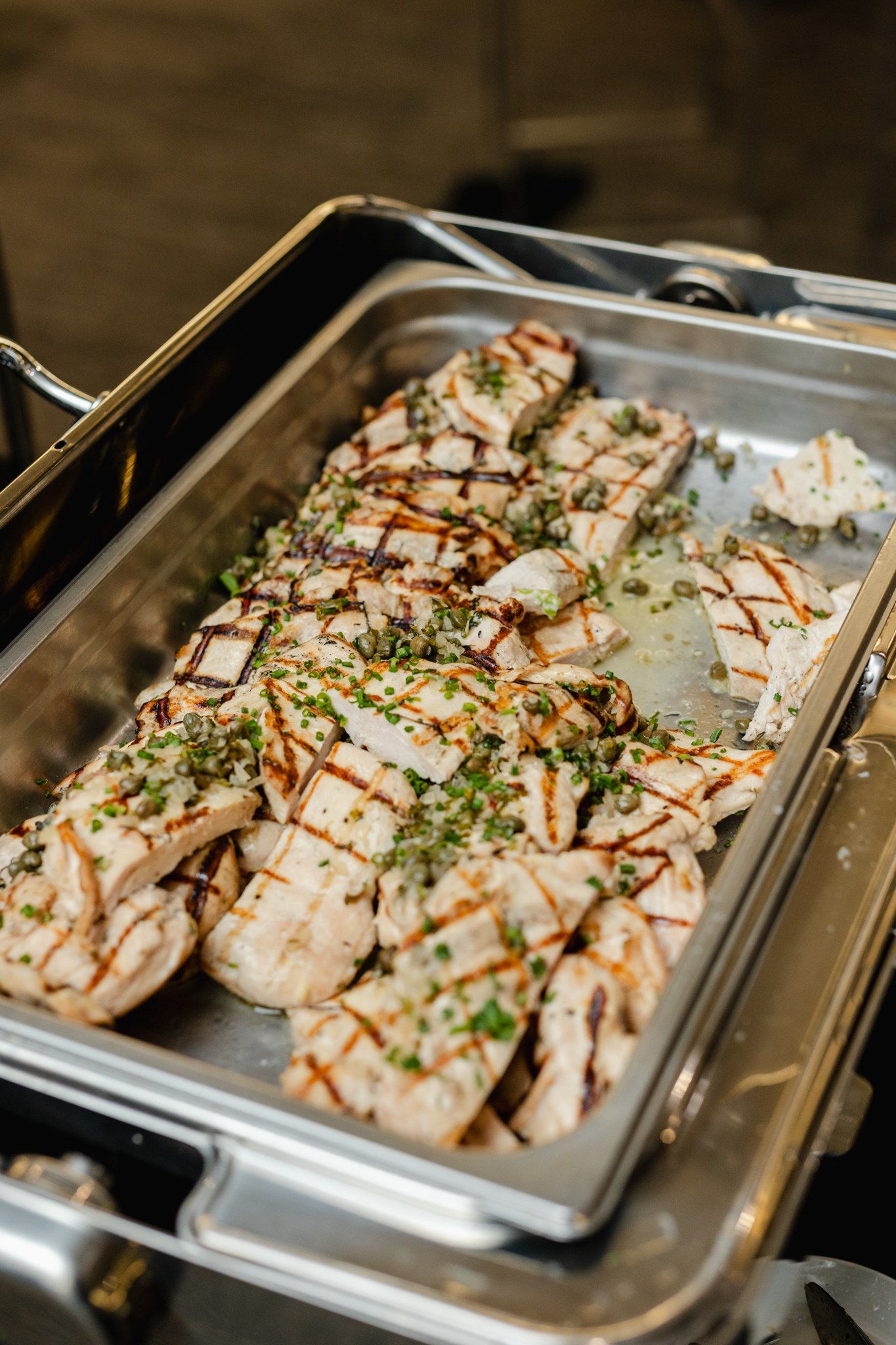 Capturing a tray of succulent grilled chicken during a conference.
