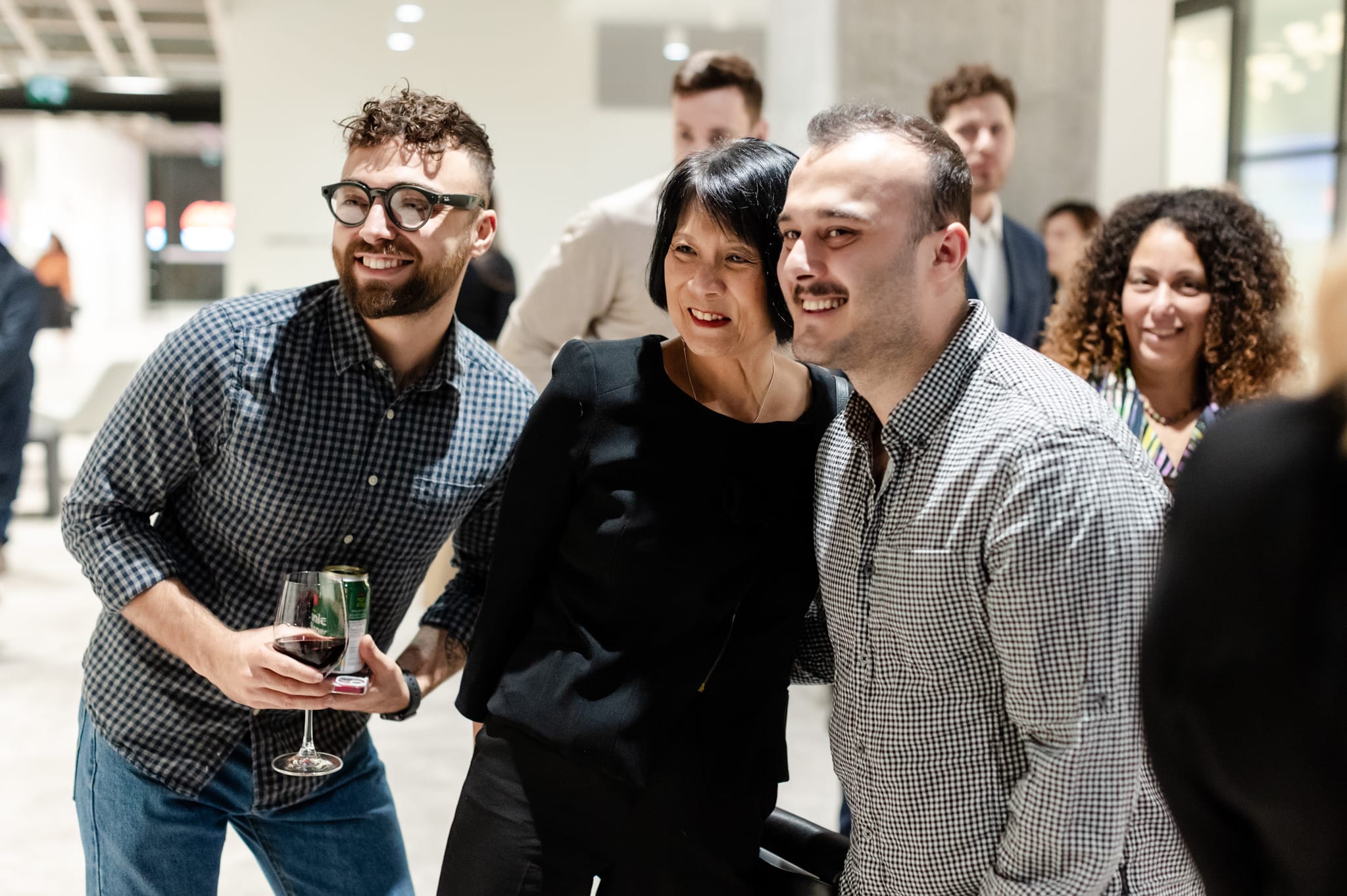 A group of people gathered at an event for photography.