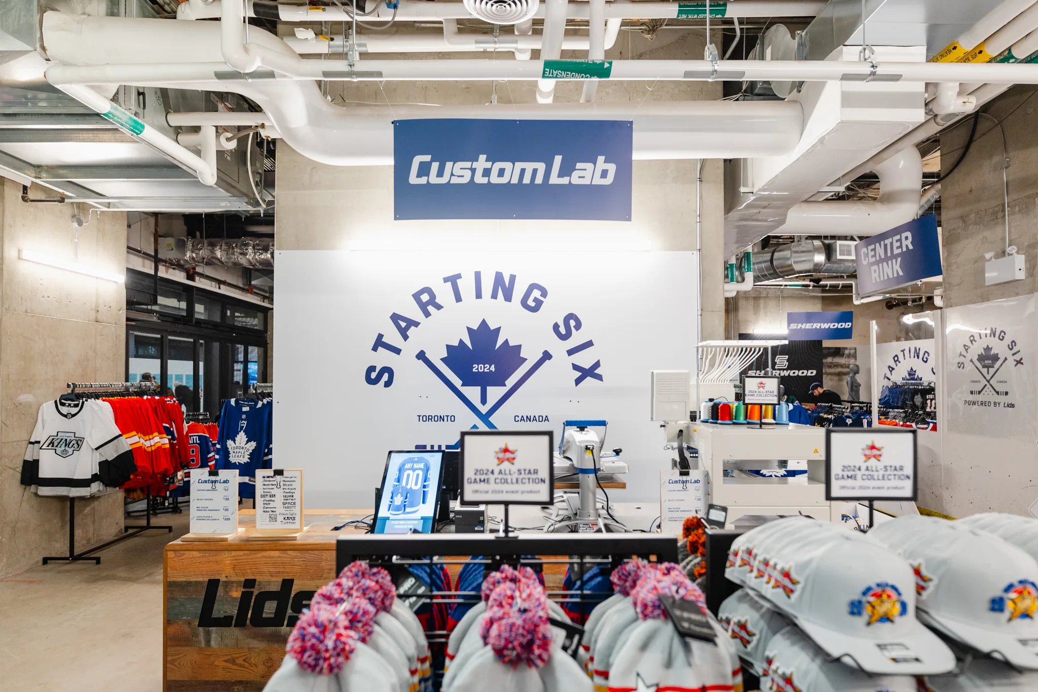 A store with a lot of hockey equipment on display, showcasing branding and photography.