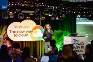 Presenter speaking at a Google Cloud event captured in corporate photography.