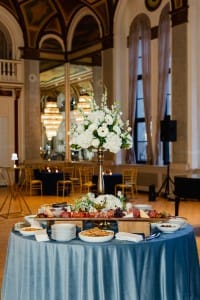 A table with a lot of food on it, captured in event photography.